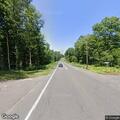 Rollover crash with car into woods in Harwinton