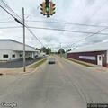 Traffic stop for tail lights on gray Jeep