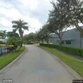 Person lying at bus stop near 11th Circle in Vero Beach