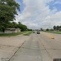 Man walking in and out of traffic on Kedzie Avenue