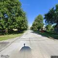 Officer checks on man walking near roadway