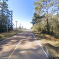 Vehicle off roadway near airport train tracks
