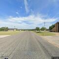 Grass fire with downed power line near abandoned structure on FM 107