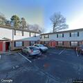 Suspicious person reported behind apartment dumpsters