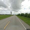 Traffic stop involving white Lexus near water tower