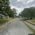 Loose dog running on Cottage Street