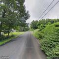Person experiencing headache on West Street in Middlefield