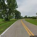 Pedestrian walking along Highway 61 shoulder