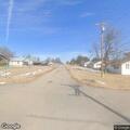 Male sitting in center of road at 6th and Choctaw