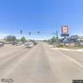 Debris blocking road at 3rd Street and 14th Avenue NW