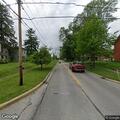 Neighbor blowing grass into roadway causing hazard