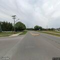Male lying in grass at Knight St and Groveport Rd