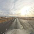 Person walking in traffic on US 84 near Peach Avenue