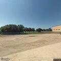 Male in sixties vomiting at high school football field