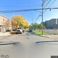 Person sitting in roadway talking to self