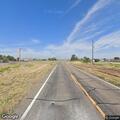 Officer assists blue hatchback on SR-56 roadside