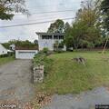 Elderly woman sneezing near Clubhouse Drive
