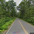 Leaning utility pole reported on Beech Hill Road