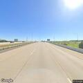 Male walking near traffic on I-29 with stroller