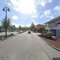 Person trying door handles on Village Lane