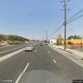 Man in 30s on bridge with feet hanging at Artesia