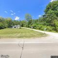 Low-hanging tree blocks road near Sand Hill Road