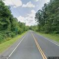 Car leaves road avoiding deer and enters woods
