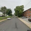 Vehicles speeding and ignoring stop sign at intersection