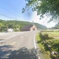 Report of property damage near road intersection