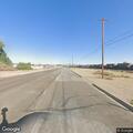 Person with back pain on Desnok Street in Needles