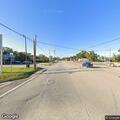 Police officer directing traffic at busy intersection