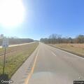Vehicles changing tire partially in roadway