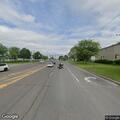 Man waving arms near Oriskany Boulevard ramp in Utica