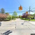 Suspicious man walking with long object in Northport