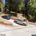 Debris fire behind address on Redwood Road