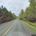 Tree on power lines ignites utility pole fire