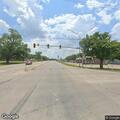 Person jumping in roadway near intersection