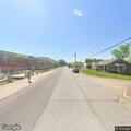 Officer checks on two people by railroad tracks