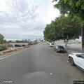 Man sitting in roadway on North Van Nuys Place