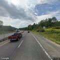 Car hits pole and gas station sign near exit 111