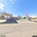 Officer checks suspicious vehicle at gas station