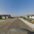 Grass fire behind housing development in Shafter