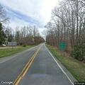 Suspicious men pushing bicycles in roadway