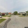 Officer checks people near Adams Drive in Richton Park