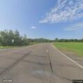 Person found lying on road shoulder near intersection