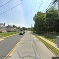 Tree blocking Saxer Avenue with wires down