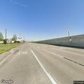Stalled vehicle on Gulf Freeway right shoulder