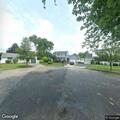 Person experiencing abdominal pain near Meadow Court in East Meadow