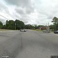Officer checks on stalled car at highway intersection