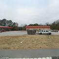 Person asking customers about robbery at gas station